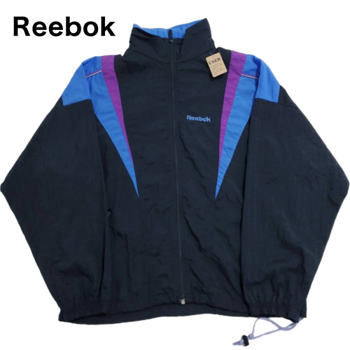 Reebok（リーボック） 黒/青/紫 マルチカラー長袖ナイロンジャケット M ...